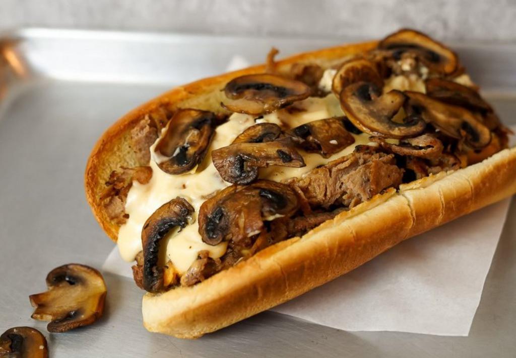 Mushroom Cheesesteak · 8” Philly cheesesteak loaded with grilled steak, melted cheese and savory grilled mushrooms on a toasted hoagie roll