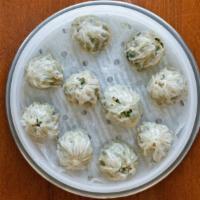 Pork Dumplings · 만두. Ten (10) pieces of freshly steamed homemade dumplings with juicy pork and vegetables. Ma...