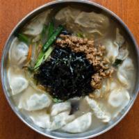 Rice Cake Dumpling Soup · 떡만두국. Homemade, thinly sliced, and perfectly cooked rice cake and pork dumplings topped with...
