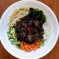 Beef Bulgogi Bibimbab · 불고기 비빔밥. Traditional Korean rice dish made by mixing a bowl of rice over a bed of bean sprou...