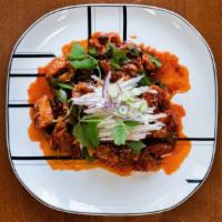 Spicy Raw Skate · 홍어회. Raw fermented skate marinated in spicy chili sauce with a medley of vegetables and spic...