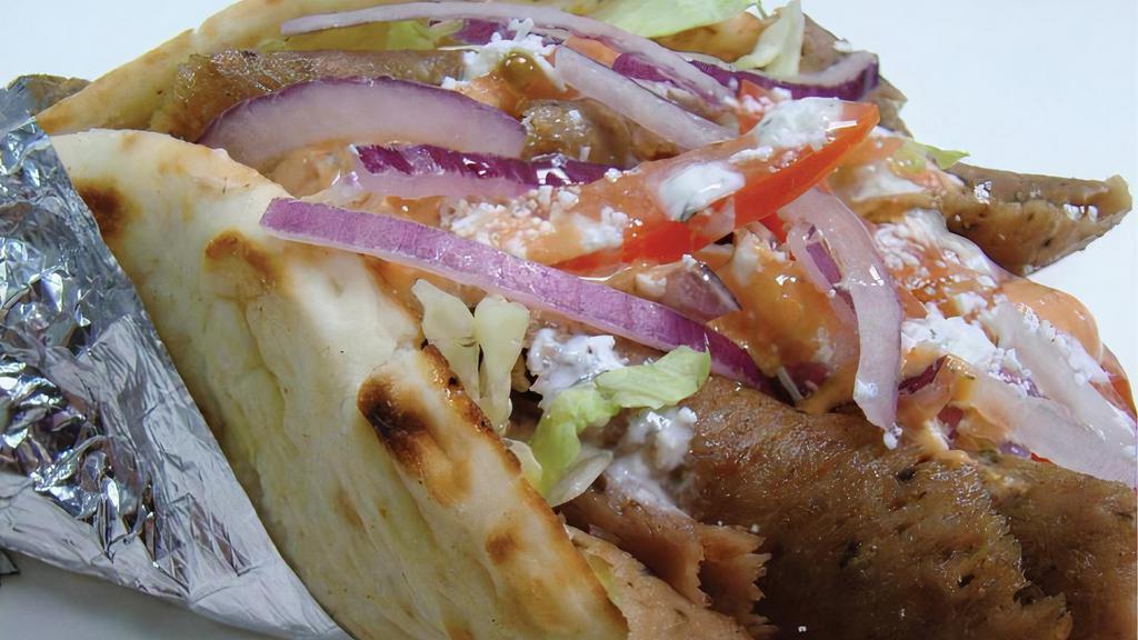 Gyro · Enjoy Grecian delight gyros that contain beef with a special spice blend.  Gyro is served on a delicious, warm pita bread with Greek yogurt tzatziki sauce, sliced red onions and fresh tomatoes.