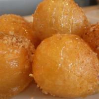 Loukoumades Large Order · Puffed pastry dipped in honey syrup and sprinkled with cinnamon and sugar