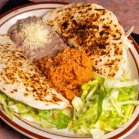 Quesadilla Dinner · Two flour tortilla with your choice of meat and melted cheese, served with rice, refried bea...