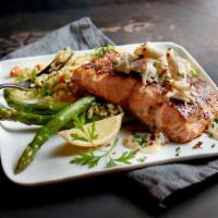 Salmon Oscar · Fresh salmon topped with lump crab meat and lemon butter. Served with choice of 2 sides.