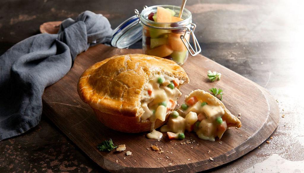 Chicken Pot Pie · Our original recipe since 1977, baked fresh daily. Carrots, onions, mushrooms and peas simmered slowly in a creamy her sauce and basked in a house-made flaky pie crust. Served with fresh fruit