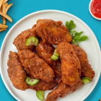 Bueno Extreme Wings  · Fresh chicken wings breaded, baked until golden brown, and tossed in Nashville Hot Sauce. Se...