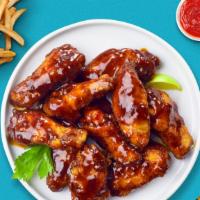 Baby Q'S Wings  · Fresh chicken wings breaded, baked until golden brown, and tossed in barbecue sauce. Served ...