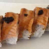 Lion King Roll · Shrimp tempura, crab salad, with seared salmon, scallion & spicy creamy sauce