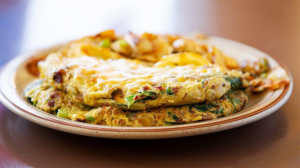 Special Omelette · Made with linguica, ham, sausage, bacon, mushrooms, bell pepper, ortega green Chile, Jack & Cheddar cheese.