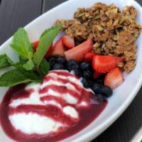 Parfait · House-made granola, plain Greek yogurt, berries, and berry sauce.