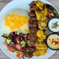Kebab Mix Plate  · Chunks of chicken thigh and beef marinated beef comes with grilled tomato, spicy pepper, sal...