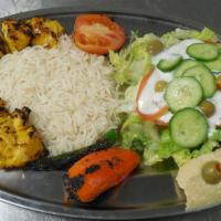 Chicken Breast Kebab · Chunks of chicken breast marinated beef comes with grilled tomato, spicy pepper, salad, rice...