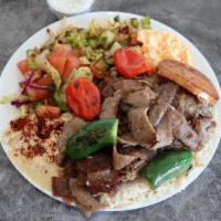 Gyro Plate · Ground lamb and beef slowly cooked on a vertical rotisserie. Comes with grilled tomato, spic...