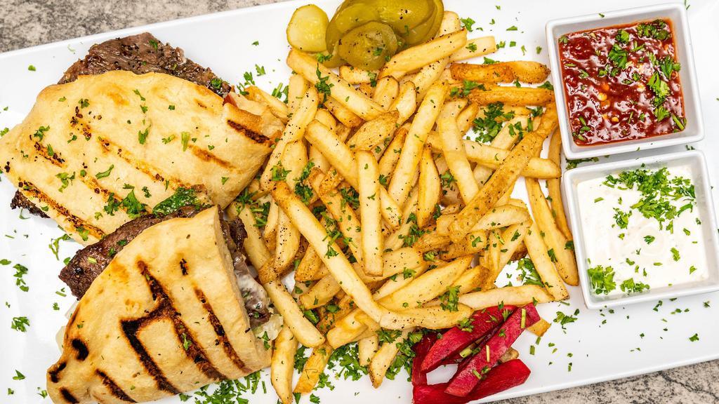 Yaba'S Steak Sandwich · Sliced seasoned and grilled rib-eye or NY strip steak with fresh sliced tomatoes, onions, lettuce, and jalapeno pepper over bottom half of grilled Jerusalem bread.
