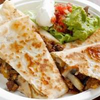 Quesadillas · Large flour tortilla filled with jack and cheddar cheese, roasted chile poblano, cilantro an...