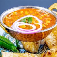 Chana Masala · Vegetarian. Gravy made with onion, tomatoes, garbanzo beans and aromatic spices.