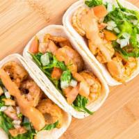 Grilled Shrimp Taco · Soft taco, lettuce, chipotle sauce, and pico de gallo.