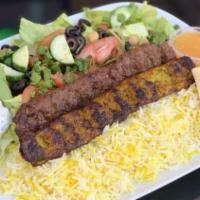 Chicken Koobideh Kabob Plate · Ground seasoned chicken kabobs served with basmati rice, side salad, fresh pita and your cho...
