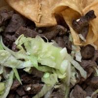 Carne Asada Taco · Lettuce, cheddar, pico de gallo and crema Mexicana.