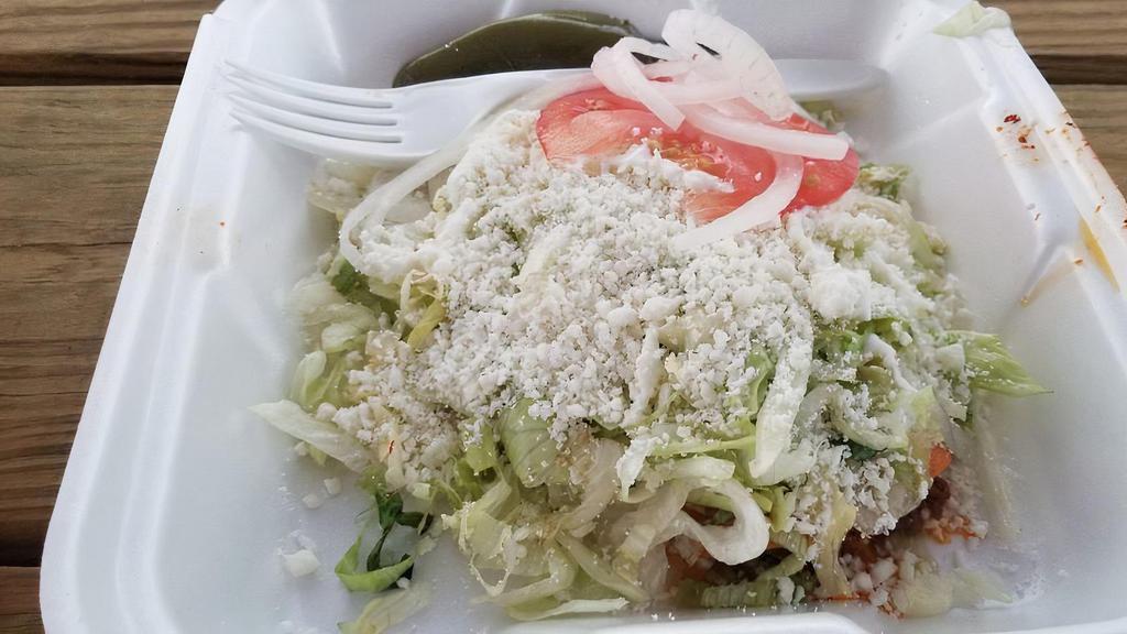 Enchilada · Choice of Papa, queso fresco or mixed includes-lettuce, includes-lettuce, sour cream, salsa salsa roja, onions, tomatoes, and jalapeños chicken drumstick or meat of your choice choice and  asada, alpastor, pollo, chorizo, birria, or carnitas single enchilada for an additional charges.