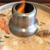 Tom Kah Seafood · Shrimp, mussels, squid, scallops, fish, mushrooms, galangal, spices in lemon grass coconut b...