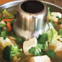 Tom Yum Vegetable & Tofu Soup · Assorted vegetables, soft tofu, spices, in lemon grass broth.