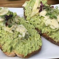 Smashed Avocado Toast · Two pieces of toast topped with smashed avocado, parmesan cheese, olive oil, salt and pepper.