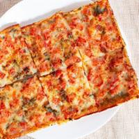Marguerite Pizza · A brushed olive oil crust topped with fresh Roma tomatoes, our special cheese blend, fresh h...