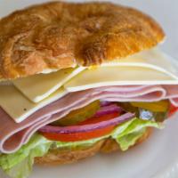 Ham Sandwich On Croissant · Ham, cheese, lettuce, tomatoes, pickles, onions, mayo and mustard.