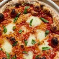 Margherita Pizza · tomato sauce + house made mozzarella + basil  (not available gluten free)