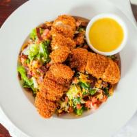 Crispy Chicken Salad · Diced hand-breaded chicken strips, diced tomatoes, sliced cucumbers, crumbled turkey bacon, ...