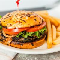 Wildflower Feta Burger · Spinach, diced tomatoes, and crumbled feta cheese mixed into our handmade ground Angus burge...