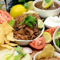Taco  Family Meal · 1 qt – choice of shredded verde pork or salsa chicken
1 pt guacamole
1/2 pt salsa
1/2 pt shr...