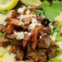 Steak & Bacon Tacos · housemade corn tortillas, chipotle aioli, seared steak, chopped bacon, onions, lettuce, sals...