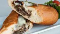 Philly Steak Sub · Shaved steak with onion, green pepper, and mushroom with melted mozzarella cheese.