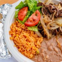 Bistec Encebollada · With Grilled Beef, Grilled Onions, Lettuce, Pico De Gallo, Guacamole, Rice and Refried Beans...