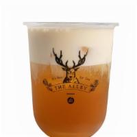 Snow Velvet Peach Oolong Tea · Premium peach oolong tea topped with our in-house cheese foam.