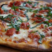 14 Inch Five Cheese  Pizza · Hosemade marinara sauce, mozzarella, asagio,fontina, parmesan, provolone, tomato, fresh basil
