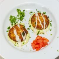 Crab Cakes · Two Dungeness crab cakes with avocado aioli