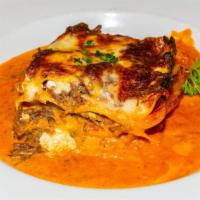 Short Rib Lasagna · pasta sheets/cechamel/ricotta/san marzano tomato pernod sauce/parmesan cheese