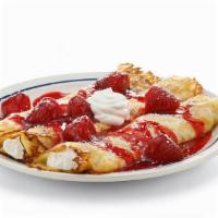 Cheese Blintzes · Three cheese-filled crepes served with sour cream. Topped with choice of blueberry compote o...