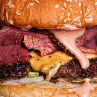 Pastrami Burger  · Grilled Pastrami, Lettuce, Tomatoes, Red Onion, Pickles and Dressing