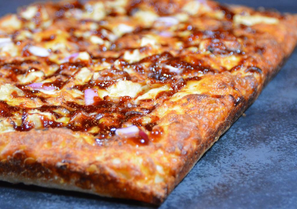Bbq Chicken Pizza · Giddy up with hickory smoked BBQ sauce, roasted chicken, and red onions. Cali-Detroit style steel pan square cut pizza (10
