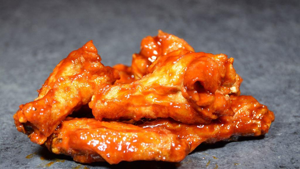 15 Wings · 15 boneless or classic bone-in wings with up to 2 flavors (dip not included