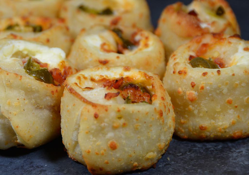 Jalapeño Poppers · Jalapeno peppers and mozzarella cheese baked in a puff pastry.