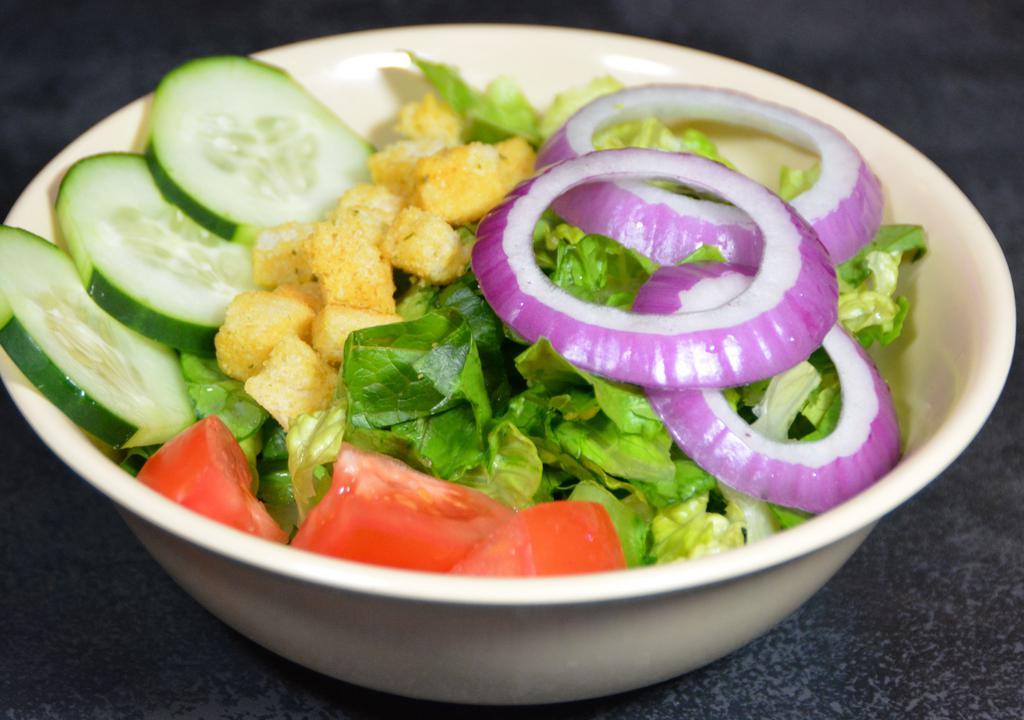 Garden Salad · Fresh garden salad with romaine lettuce, sliced tomato, cucumbers, red onion, and croutons.