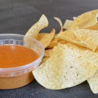 Chips & Queso · Melted queso sauce with a perfect blend of Mexican spices served with crispy corn tortilla c...