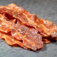 Boss. Bacon · Thick sliced hickory smoked bacon, caramelized with pepper flecks for an extra kick.