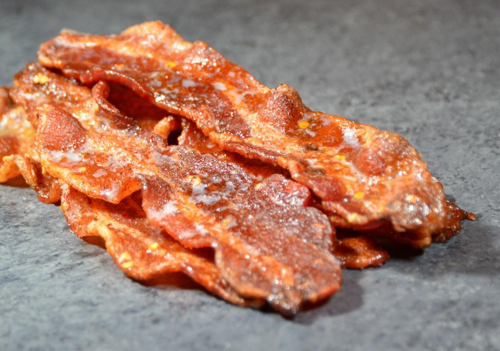Boss. Bacon · Thick sliced hickory smoked bacon, caramelized with pepper flecks for an extra kick.